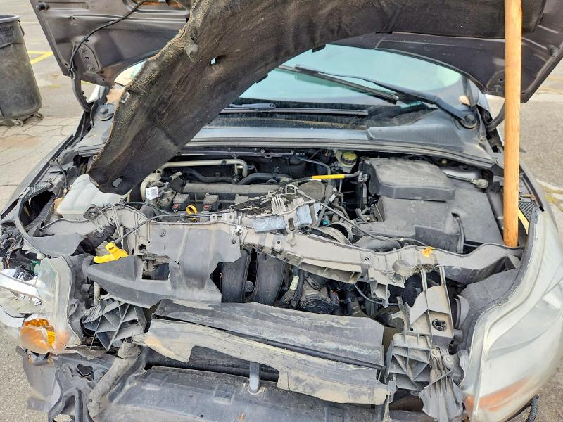 Снимка 11 от търг – 2014 FORD FOCUS с VIN 1FADP3K25EL317054