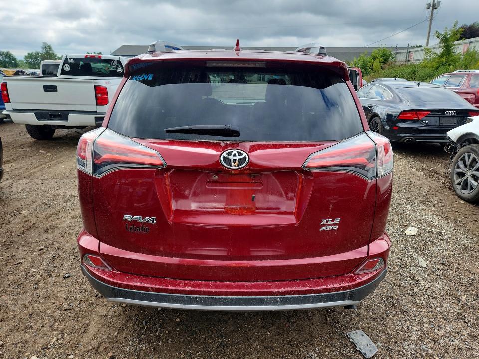 Photo 6 from auction – 2018 TOYOTA RAV4 with VIN 2T3RFREV2JW740743