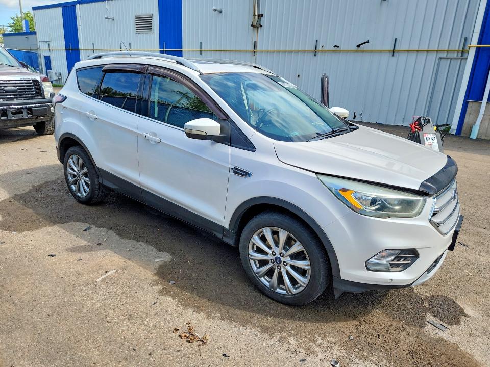 Photo 4 from auction – 2017 FORD ESCAPE with VIN 1FMCU9J98HUC39959