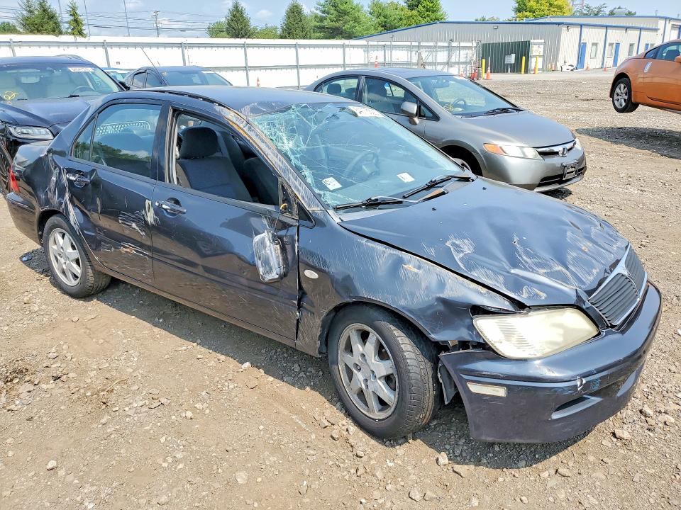 Снимка 4 от търг – 2002 MITSUBISHI LANCER с VIN JA3AJ36E52U053776
