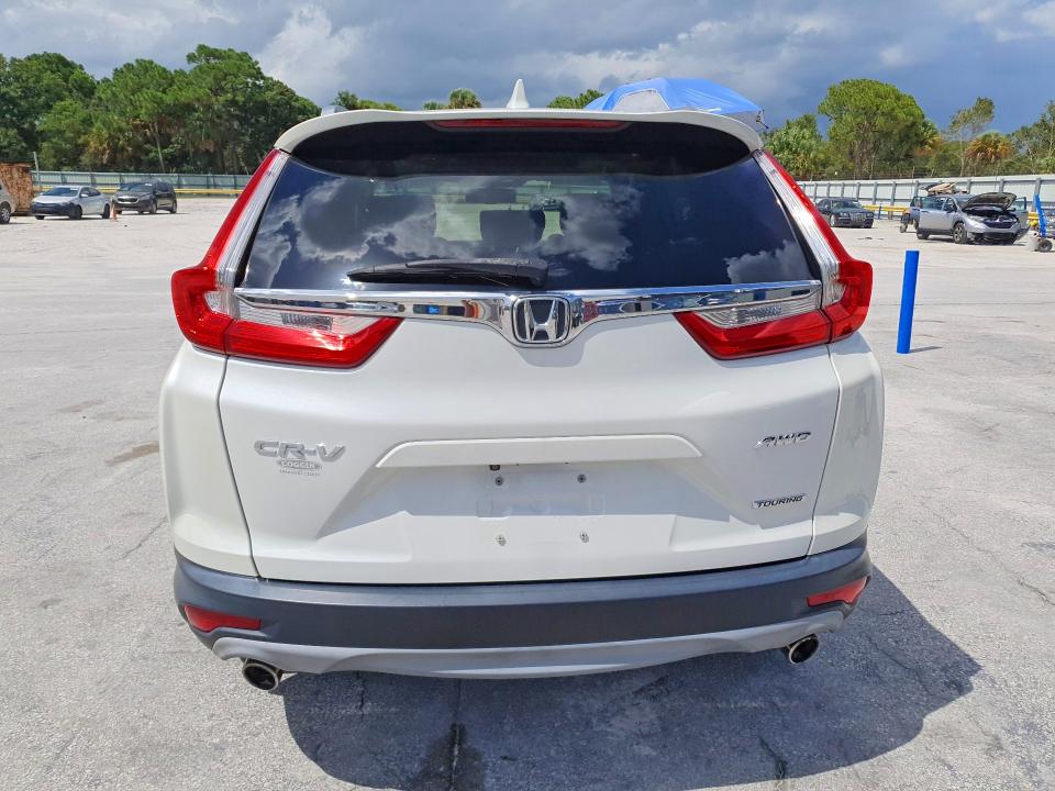 Photo 6 from auction – 2017 HONDA CR-V with VIN 5J6RW2H9XHL042099