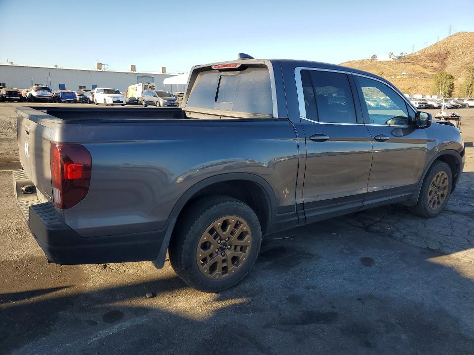 Photo 3 from auction – 2023 HONDA RIDGELINE with VIN 5FPYK3F56PB058246