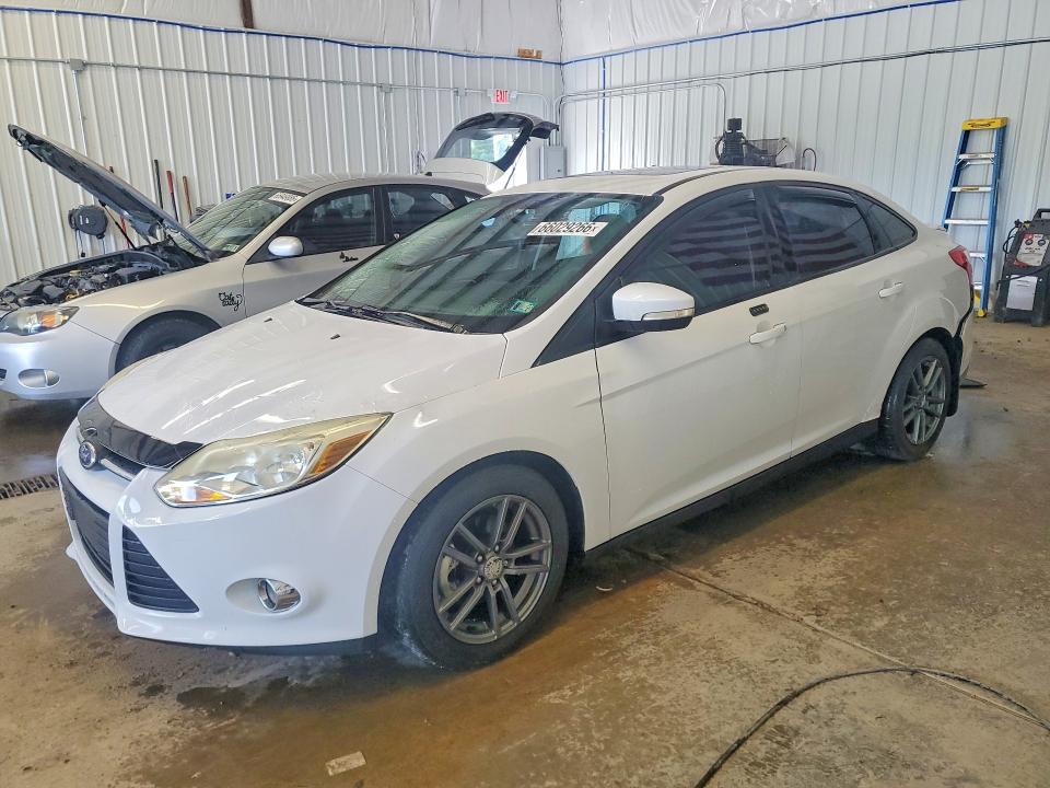 FORD FOCUS 2014 with VIN 1FADP3F24EL292688 - Photo from auction
