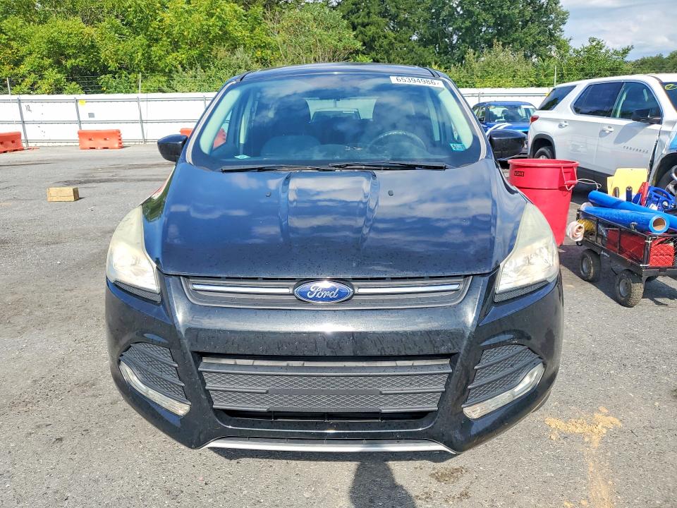 Photo 5 from auction – 2015 FORD ESCAPE with VIN 1FMCU9GX0FUC00334