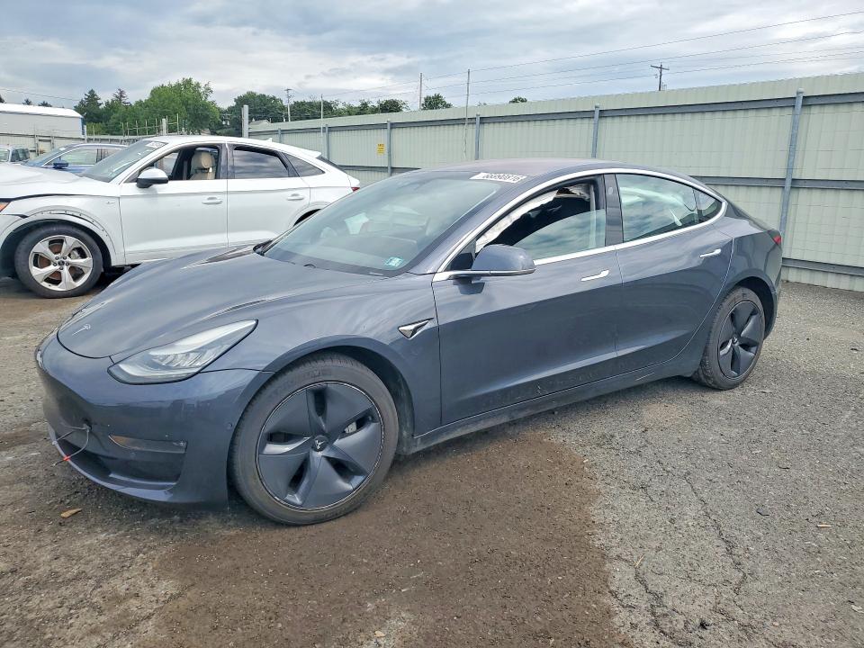 TESLA MODEL 3 2018 with VIN 5YJ3E1EB3JF087099 - Photo from auction