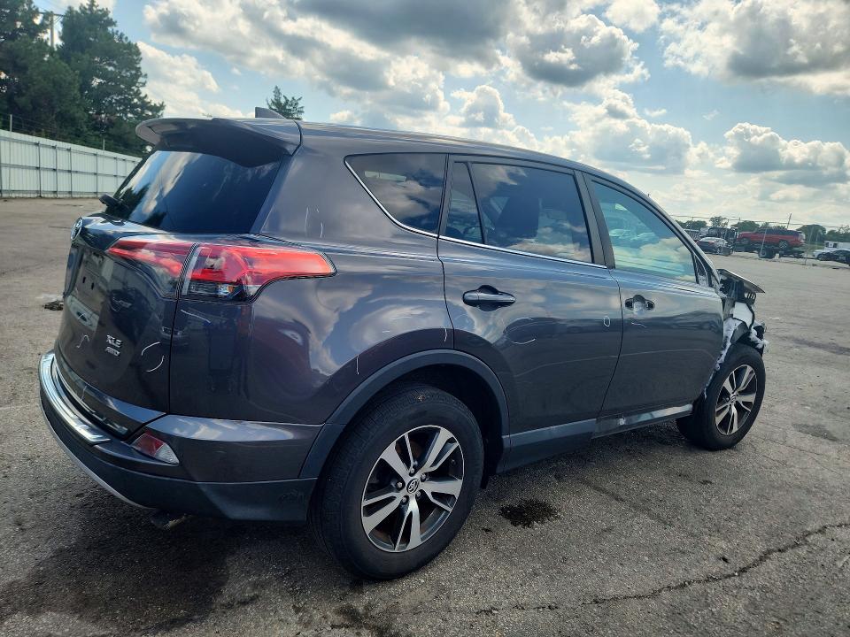 Photo 3 from auction – 2018 TOYOTA RAV4 with VIN 2T3RFREV5JW797910