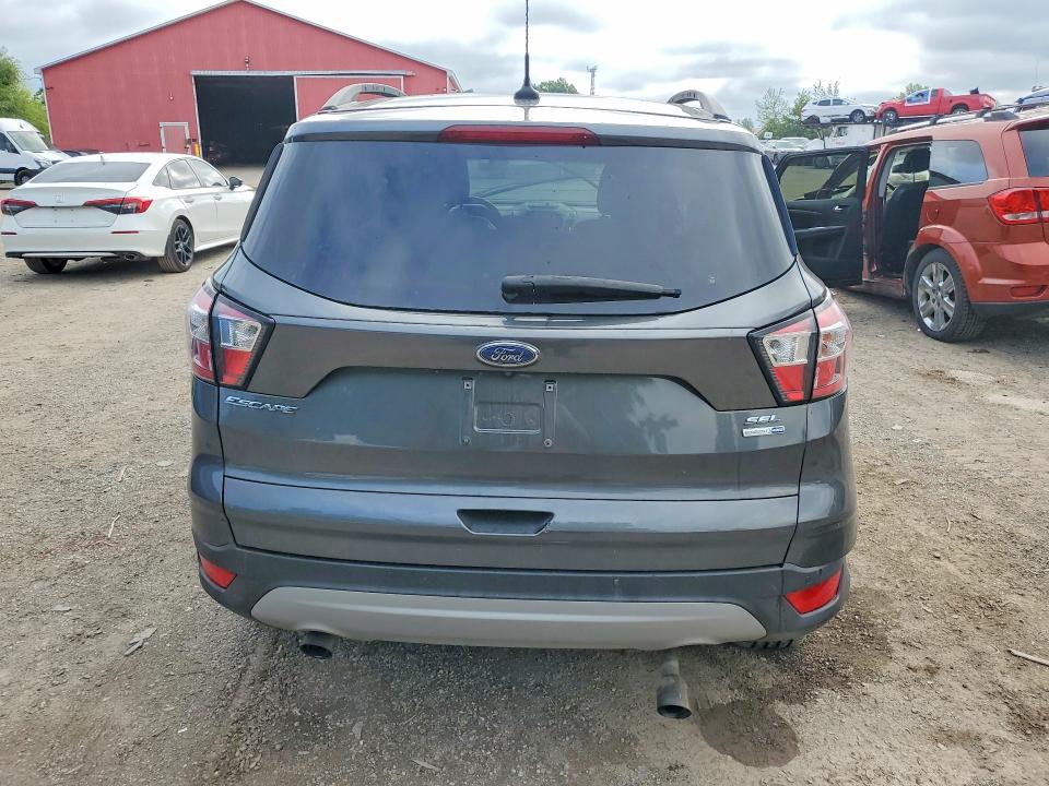 Foto 6 de la subasta – 2018 FORD ESCAPE con VIN 1FMCU9HD5JUB62936