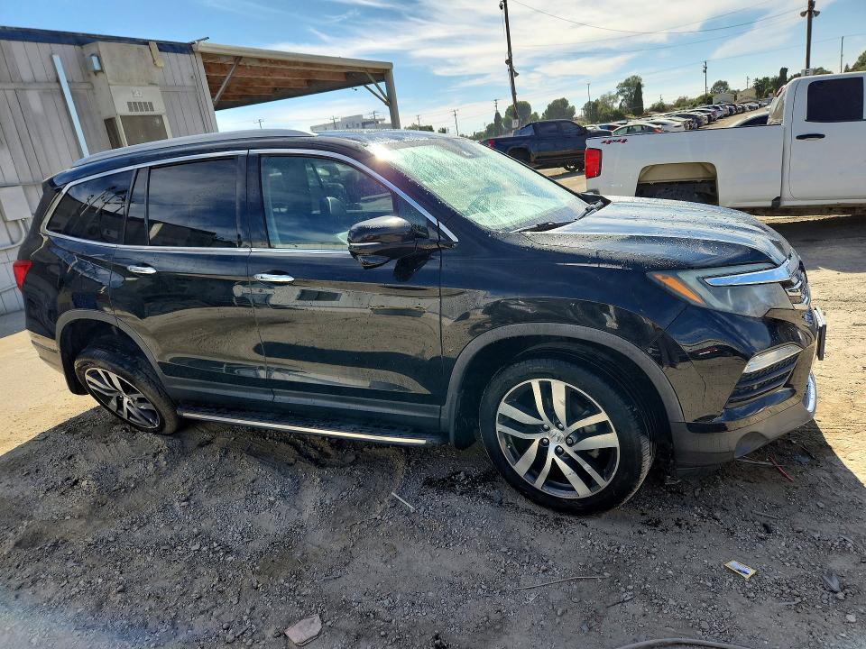 Foto 4 de la subasta – 2016 HONDA PILOT con VIN 5FNYF5H92GB011384