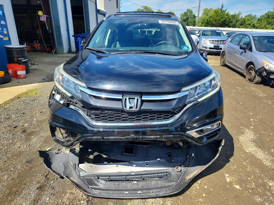 Photo 5 from auction – 2016 HONDA CR-V with VIN 5J6RM4H74GL055395