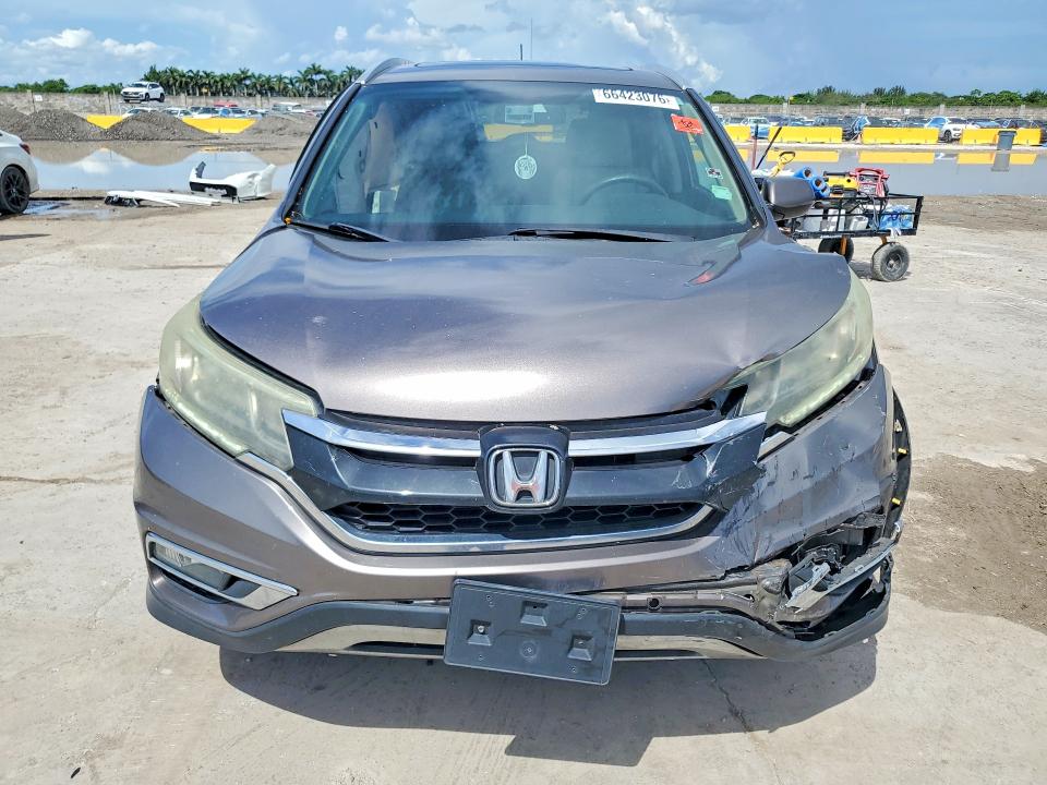 Photo 5 from auction – 2015 HONDA CR-V with VIN 5J6RM4H73FL042409