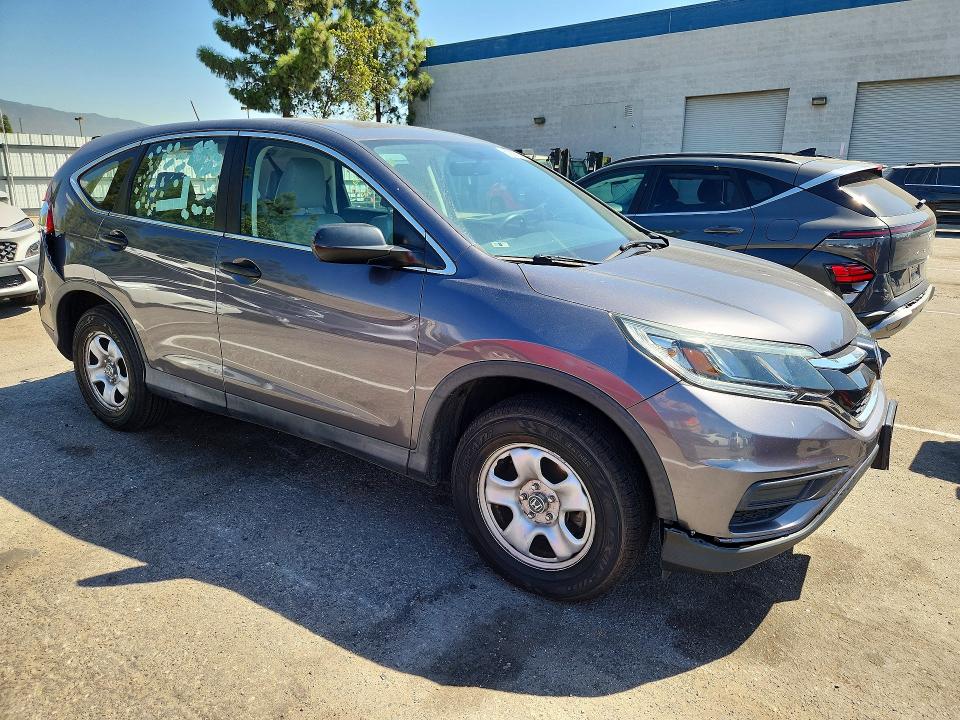 Photo 4 from auction – 2015 HONDA CR-V with VIN 2HKRM3H35FH504700