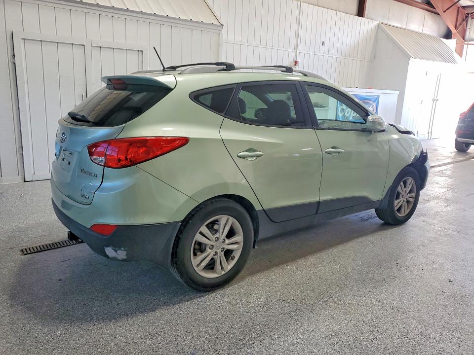 Photo 3 from auction – 2012 HYUNDAI TUCSON with VIN KM8JUCAC5CU385454