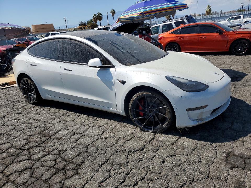 Снимка 4 от търг – 2021 TESLA MODEL 3 с VIN 5YJ3E1ECXMF072225