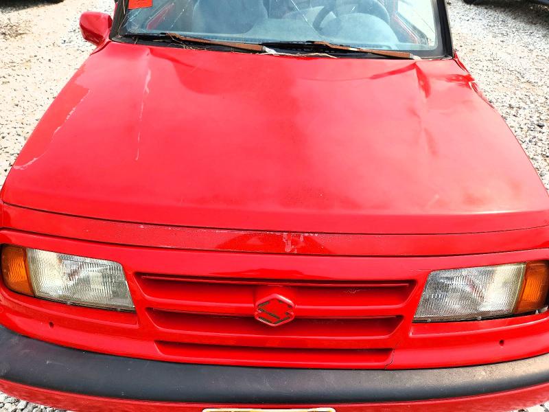 Снимка 11 от търг – 1997 SUZUKI SIDEKICK с VIN 2S3TE02V1V6404478