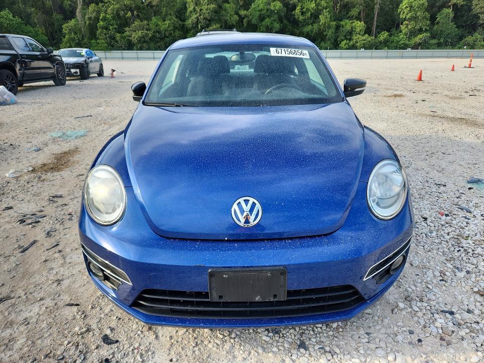 Photo 5 from auction – 2014 VOLKSWAGEN BEETLE with VIN 3VWVS7AT8EM662430