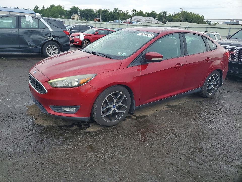 FORD FOCUS 2017 with VIN 1FADP3H24HL305697 - Photo from auction
