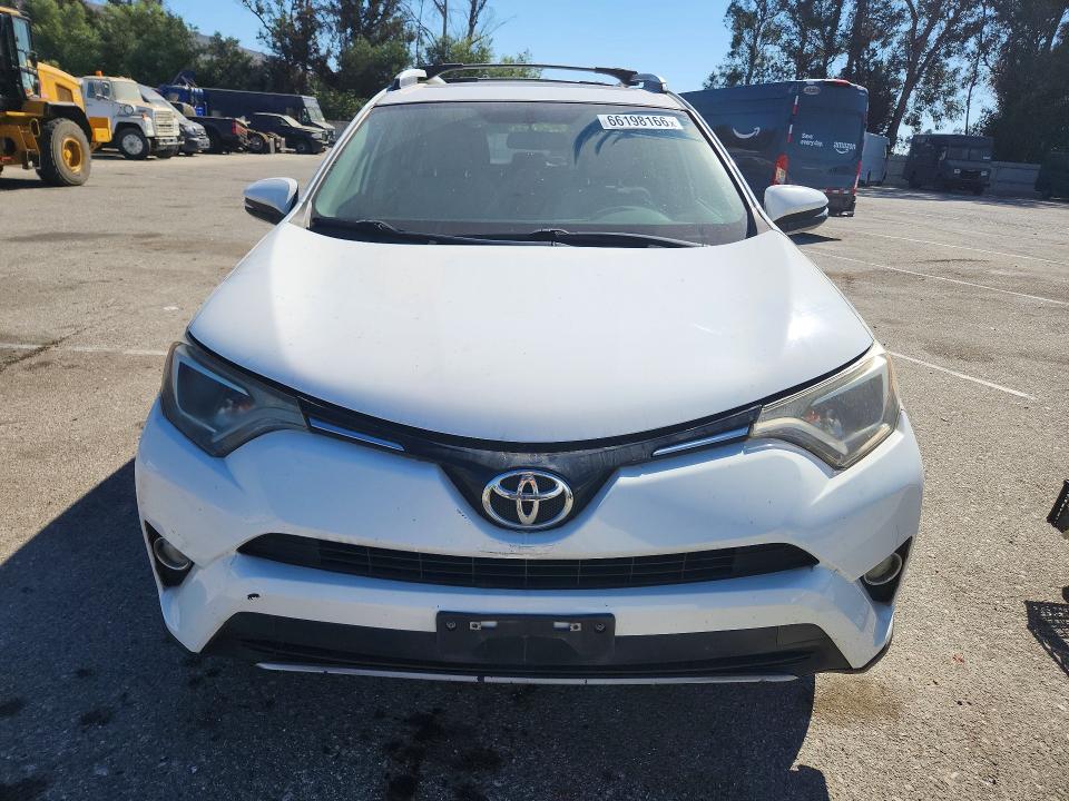 Photo 5 from auction – 2016 TOYOTA RAV4 with VIN 2T3WFREV6GW265626