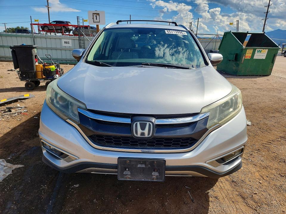 Photo 5 from auction – 2015 HONDA CR-V with VIN 5J6RM4H92FL107283