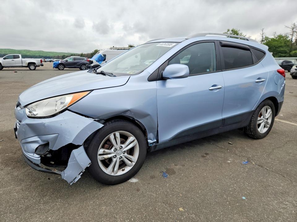 HYUNDAI TUCSON 2011 with VIN KM8JUCAC0BU200631 - Photo from auction