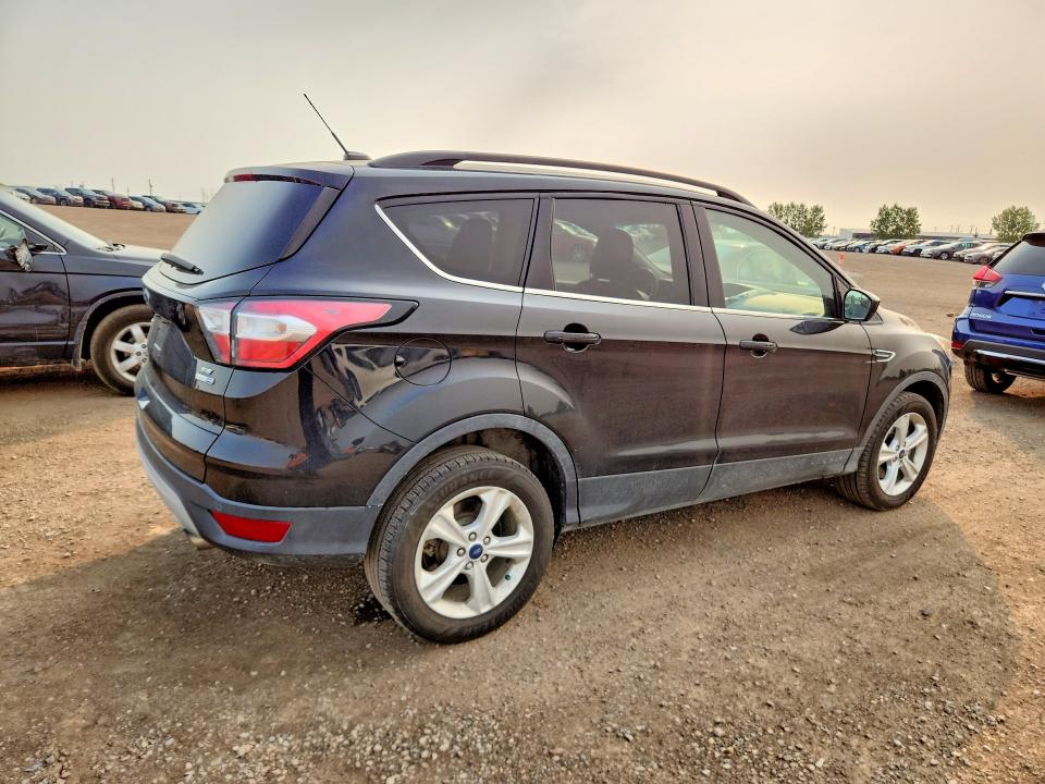 Photo 3 from auction – 2018 FORD ESCAPE with VIN 1FMCU9GD6JUC82665