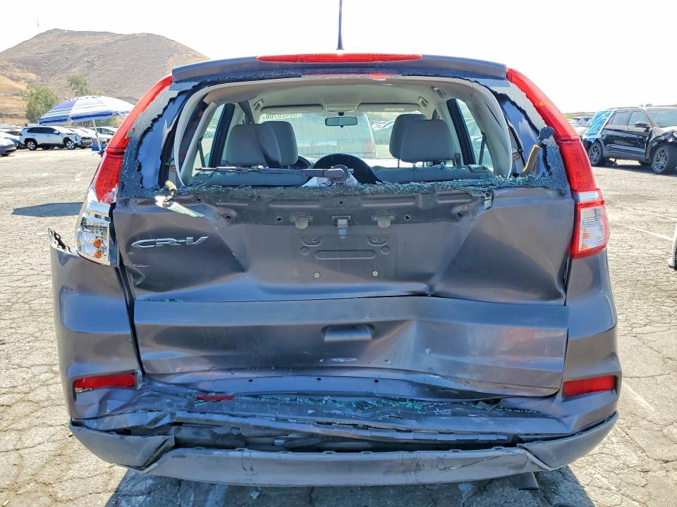 Photo 6 from auction – 2015 HONDA CR-V with VIN 3CZRM3H30FG700580