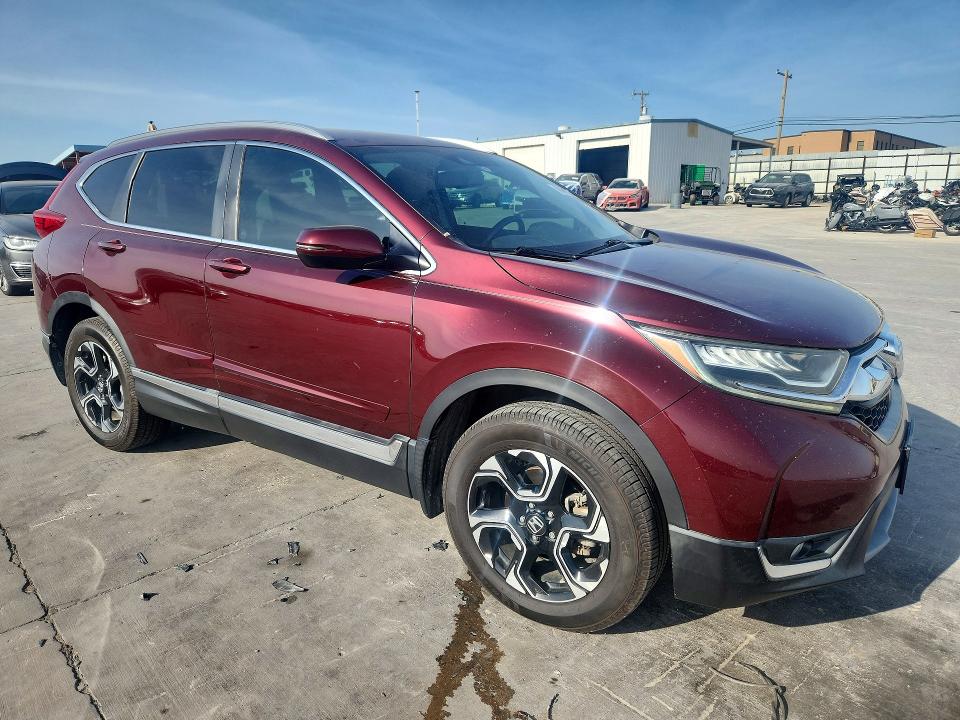 Photo 4 from auction – 2018 HONDA CR-V with VIN 7FARW2H91JE097530