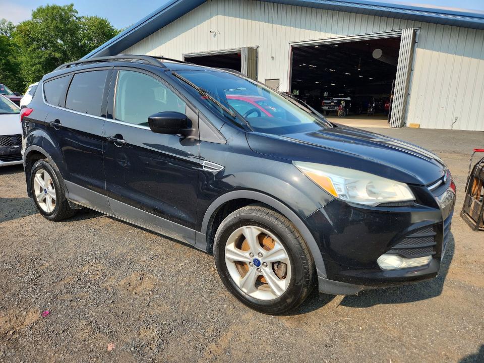 Photo 4 from auction – 2014 FORD ESCAPE with VIN 1FMCU9G98EUE04749