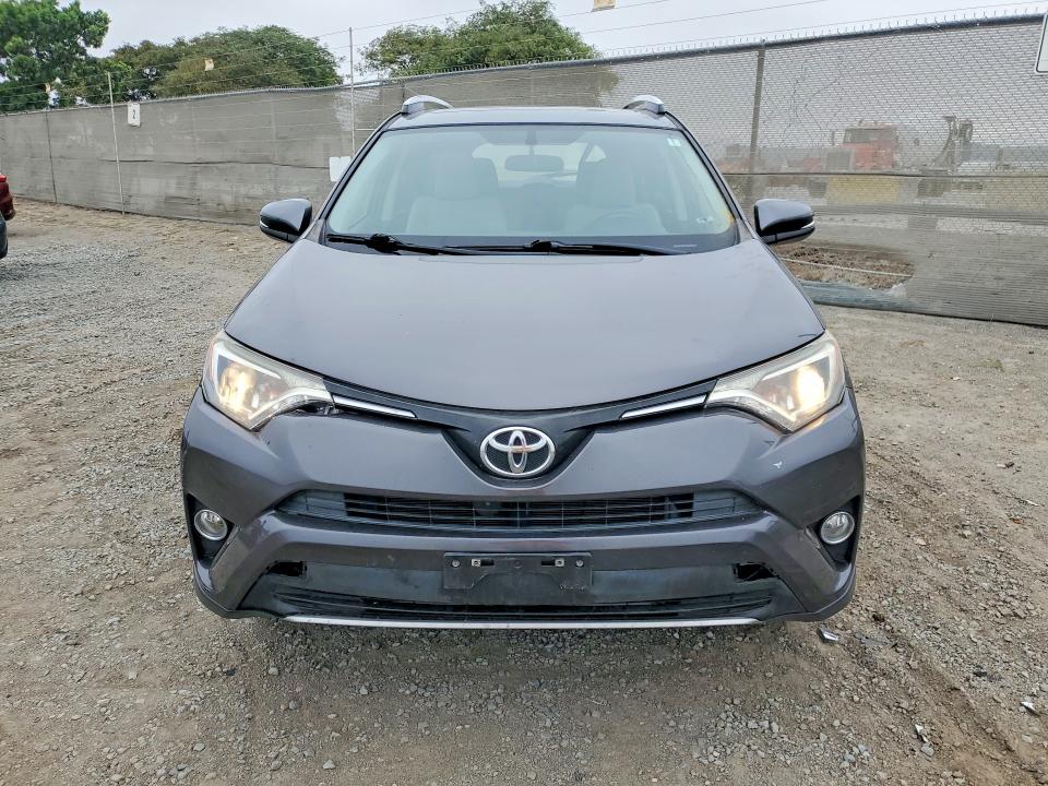 Photo 5 from auction – 2016 TOYOTA RAV4 with VIN JTMWFREV5GJ092924