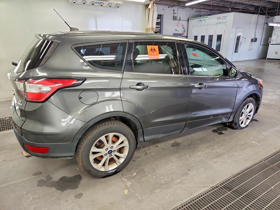 Photo 3 from auction – 2017 FORD ESCAPE with VIN 1FMCU9GDXHUE09931
