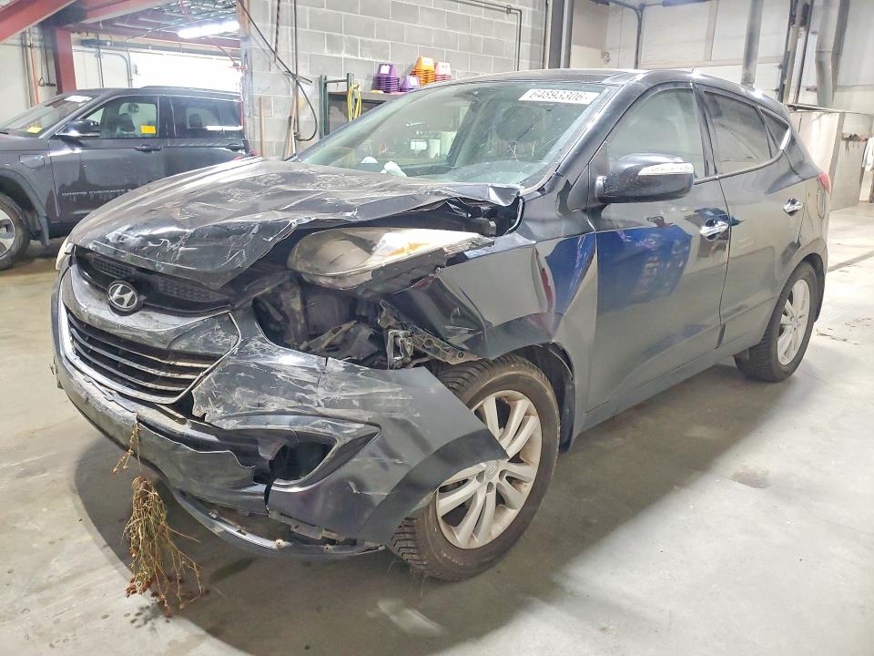 HYUNDAI TUCSON 2010 with VIN KM8JUCAC4AU085336 - Photo from auction