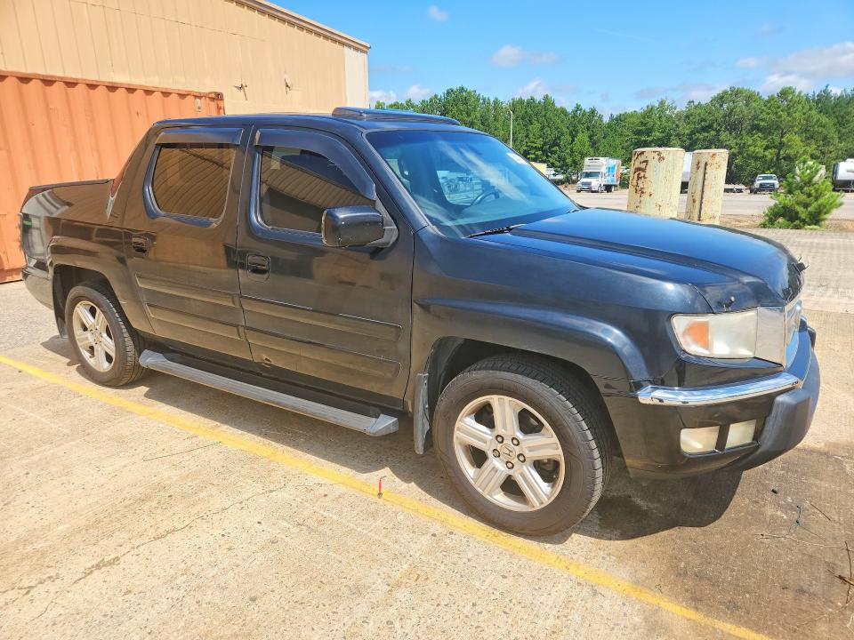 Photo 4 from auction – 2011 HONDA RIDGELINE with VIN 5FPYK1F50BB009847