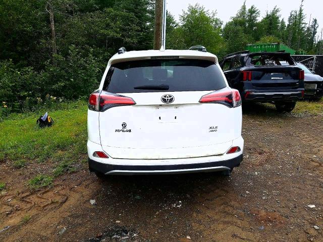 Photo 6 from auction – 2018 TOYOTA RAV4 with VIN 2T3RFREV5JW734872