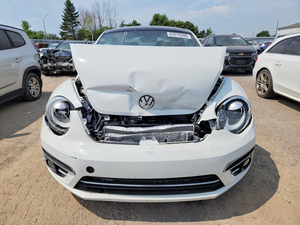Photo 5 from auction – 2019 VOLKSWAGEN BEETLE with VIN 3VWJD7AT7KM707071