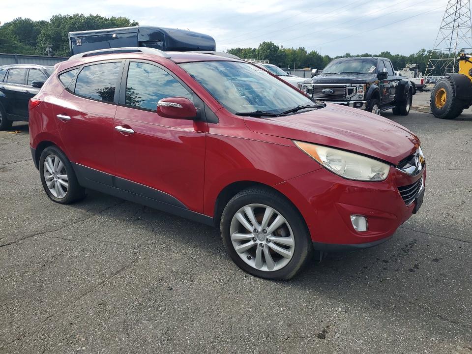 Photo 4 from auction – 2010 HYUNDAI TUCSON with VIN KM8JUCAC2AU021604