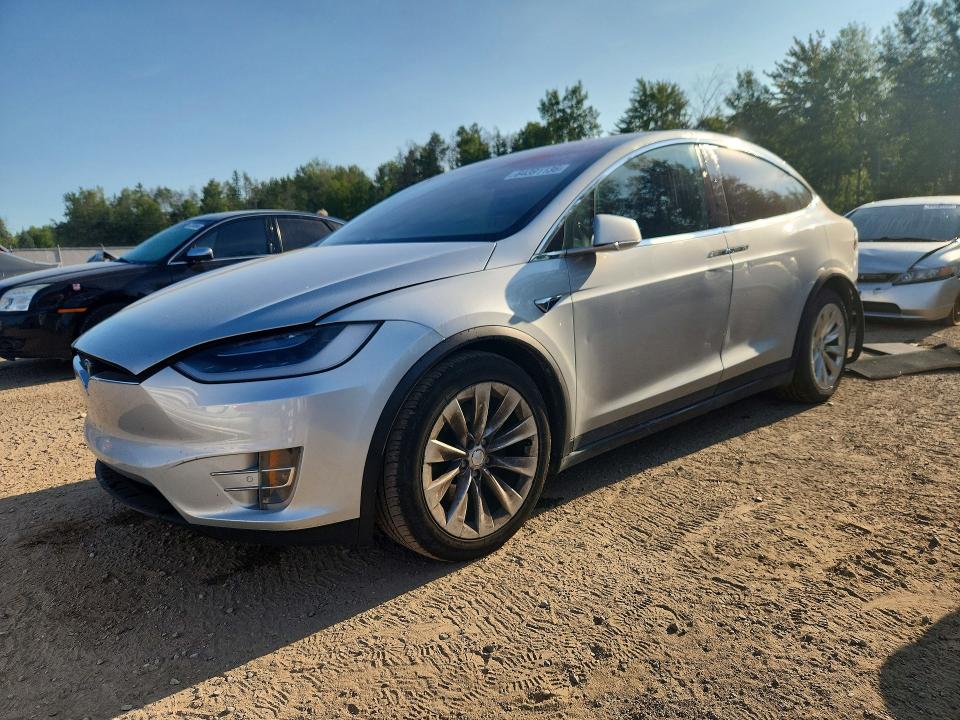 TESLA MODEL X 2018 with VIN 5YJXCAE21JF102111 - Photo from auction