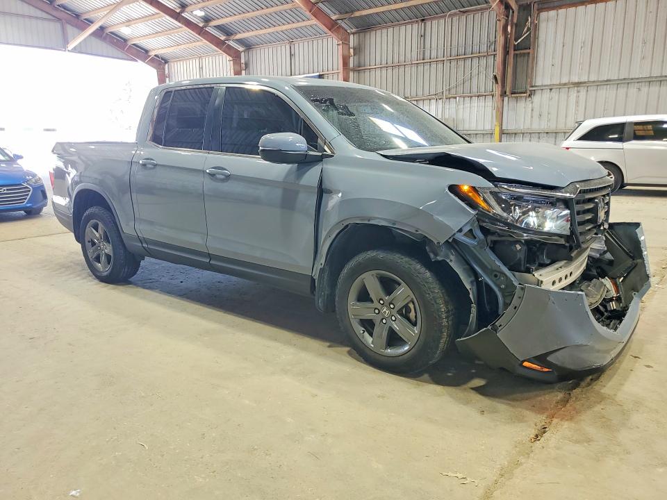Photo 4 from auction – 2023 HONDA RIDGELINE with VIN 5FPYK3F52PB038561
