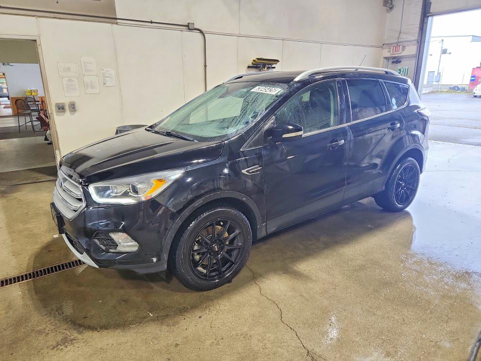 FORD ESCAPE 2018 with VIN 1FMCU9J92JUD44261 - Photo from auction