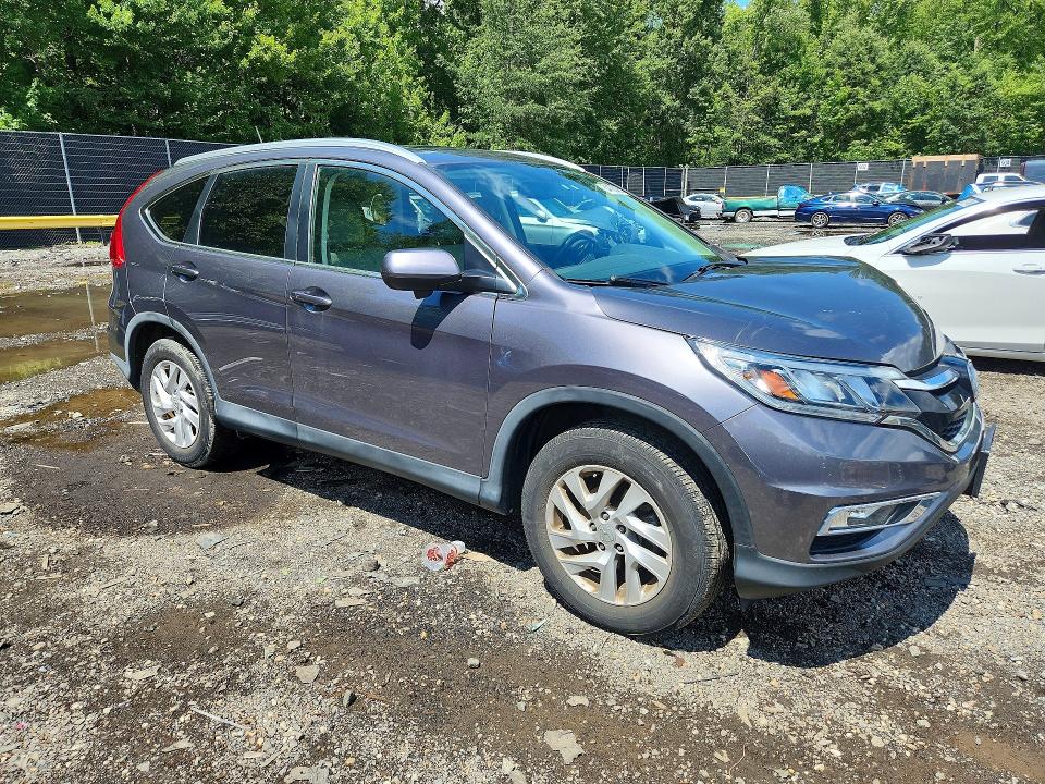 Photo 4 from auction – 2015 HONDA CR-V with VIN 2HKRM4H77FH608307
