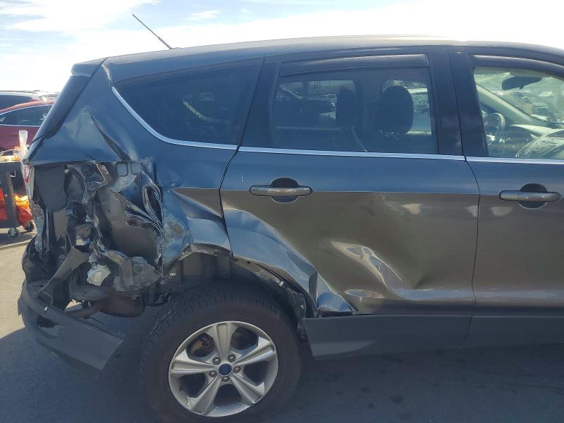 Photo 11 from auction – 2015 FORD ESCAPE with VIN 1FMCU9GX4FUC10011