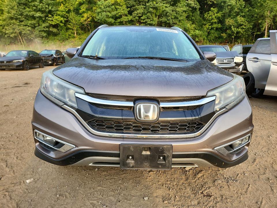 Photo 5 from auction – 2015 HONDA CR-V with VIN 5J6RM4H96FL009700