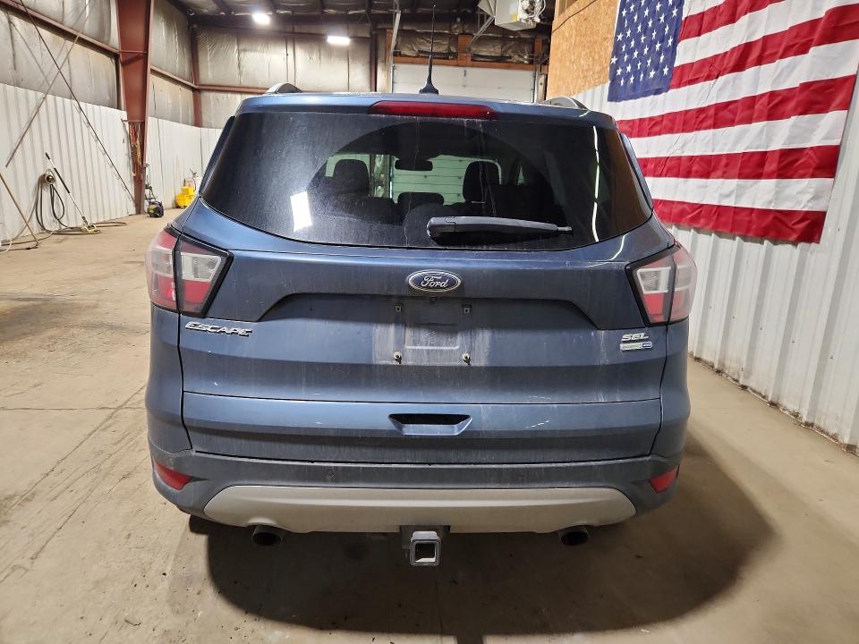 Photo 6 from auction – 2018 FORD ESCAPE with VIN 1FMCU9HD3JUC10417