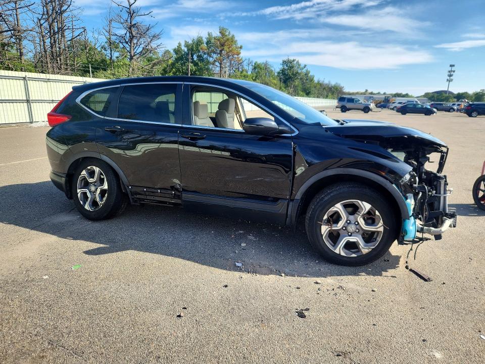 Photo 4 from auction – 2018 HONDA CR-V with VIN 7FARW2H54JE104578