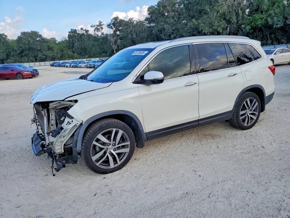 HONDA PILOT 2017 with VIN 5FNYF5H98HB005428 - Photo from auction