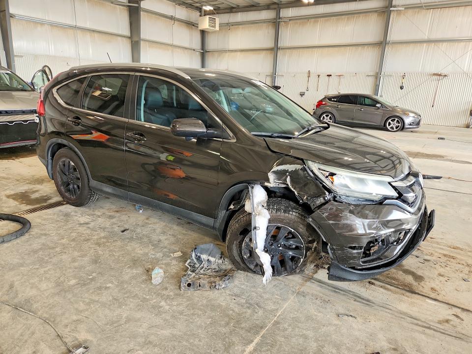 Photo 4 from auction – 2015 HONDA CR-V with VIN 2HKRM4H73FH625489