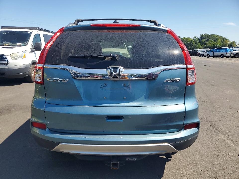 Photo 6 from auction – 2015 HONDA CR-V with VIN 2HKRM4H79FH642653