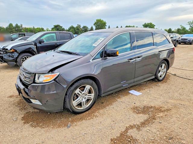 HONDA ODYSSEY 2012 مع رقم تعريف المركبة 5FNRL5H96CB014294 - صورة من المزاد