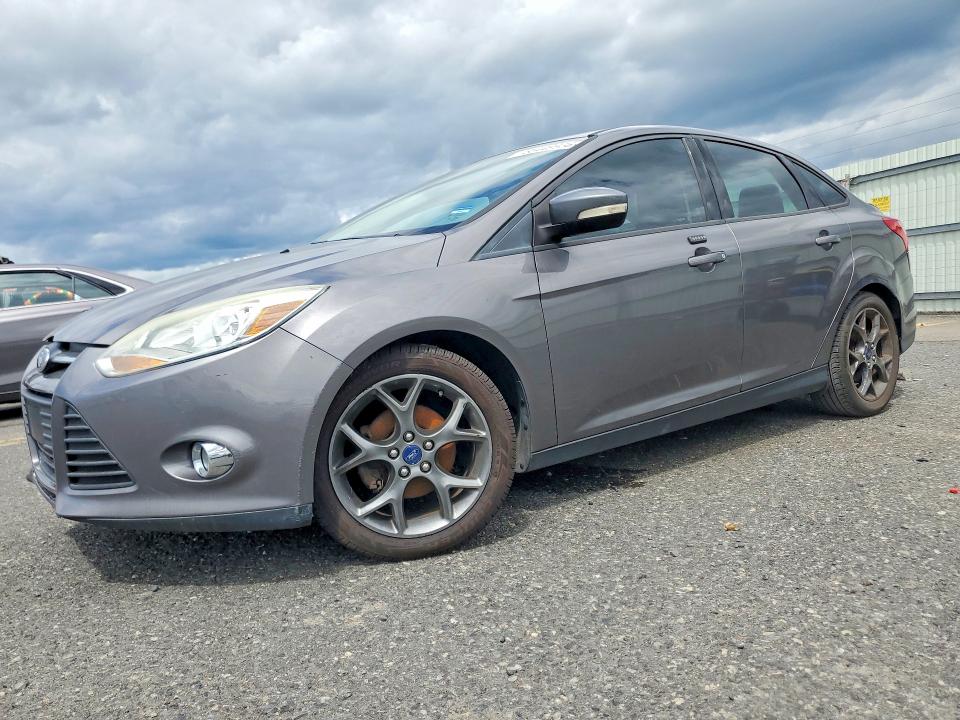 FORD FOCUS 2014 with VIN 1FADP3F23EL202317 - Photo from auction