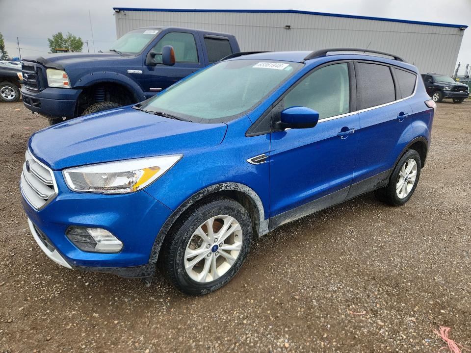 FORD ESCAPE 2018 with VIN 1FMCU9GD4JUA26007 - Photo from auction