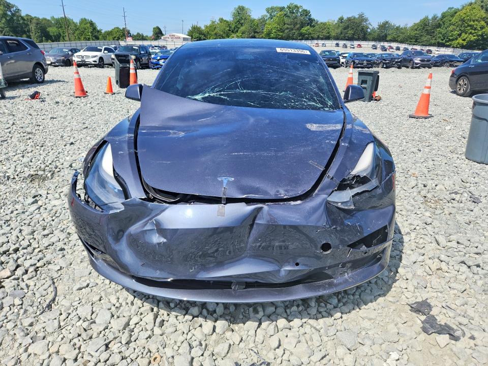Photo 5 from auction – 2021 TESLA MODEL 3 with VIN 5YJ3E1EA1MF099800