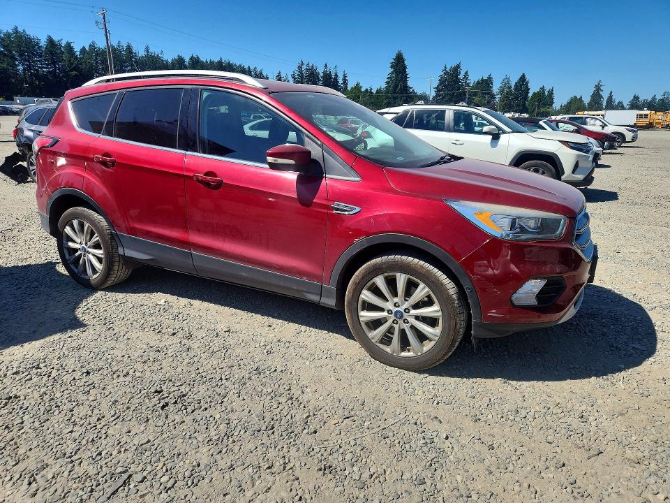 Photo 4 from auction – 2018 FORD ESCAPE with VIN 1FMCU9J91JUA65111